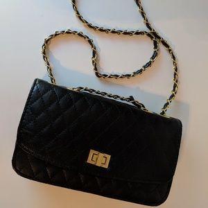 Black quilted purse with gold chain strap